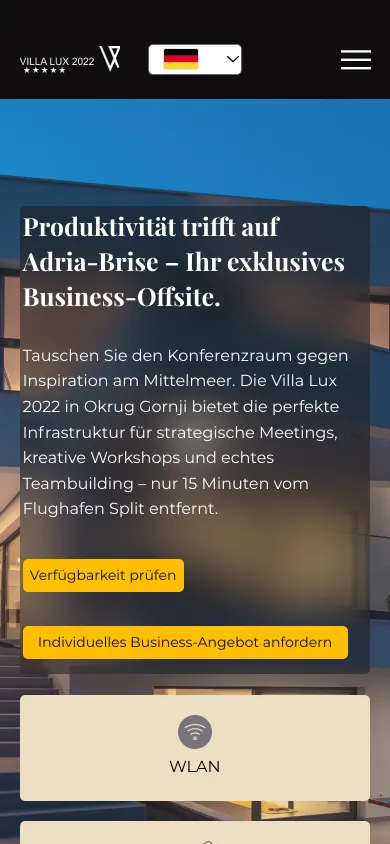 Seite Business-Retreats auf dem Handy mit Überschrift, Text, zwei gelben Knöpfen und der Kachel WLAN, Screenshot vom 17.10.2026